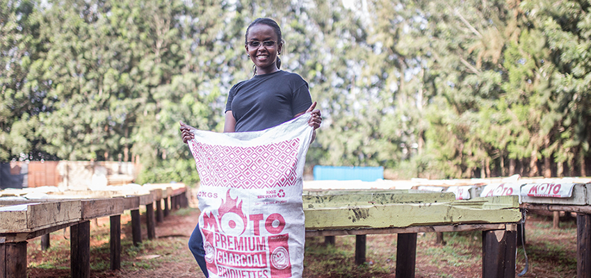 D-Lab Scale-Ups Fellow Chebet Lesan holds a bag of her company's innovative charcoal briquettes, which are made from recycled waste. Lesan is the founder and CEO of BrightGreen Renewable Energy, which provides affordable, clean, safe, and eco-friendly charcoal briquettes for low-income households in Kenya.