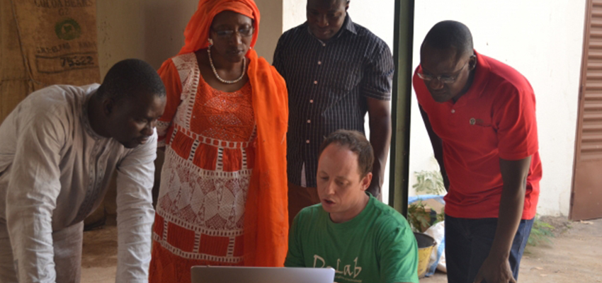 MIT D-Lab researcher Eric Verploegen (seated) kicks off a CITE evaluation of vegetable cooling technologies with partners at the World Vegetable Center. Photo: Lauren McKown