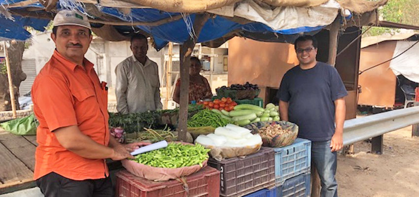 Vinay Sanchela (CInI) and Anish Antony (MIT D-Lab) with retail vendors in Mahisagar, Gujarat 