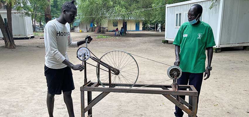 Participants in an MIT D-Lab Creative Capacity Building for Business training demonstrating the knife grinder they built in the innovation center in Duk, South Sudan. Photo: MIT D-Lab/Heewon Lee