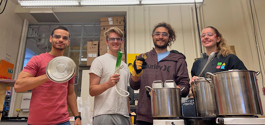 The process of boiling our team’s thermal batteries and placing them inside a ¼ scale chick brooder for testing. Photo: Courtesy MIT D-Lab