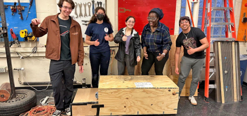 Chicken brooder team after starting a heat chamber test run with the quarter size chicken box.. Photo: Courtesy MIT D-Lab