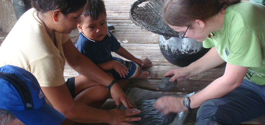 D-Lab student working with community members to create a stove. Photo: MIT D-Lab