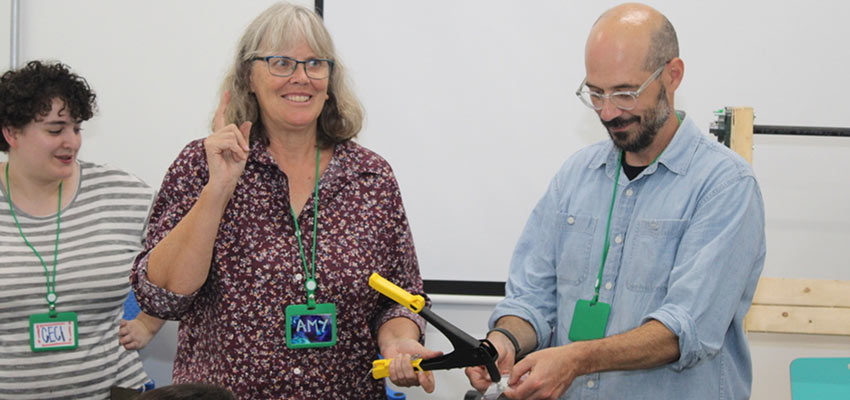 Amy Smith (center), professor of mechanical engineering at MIT and founder of the MIT D-Lab, and Michael Tarkanian, professor of materials science and engineering, lead a Machine Elements and Advanced Design training for ASPIRE at UVG's makerspace D-Hive. Credits: Photo courtesy of the ASPIRE Project. 