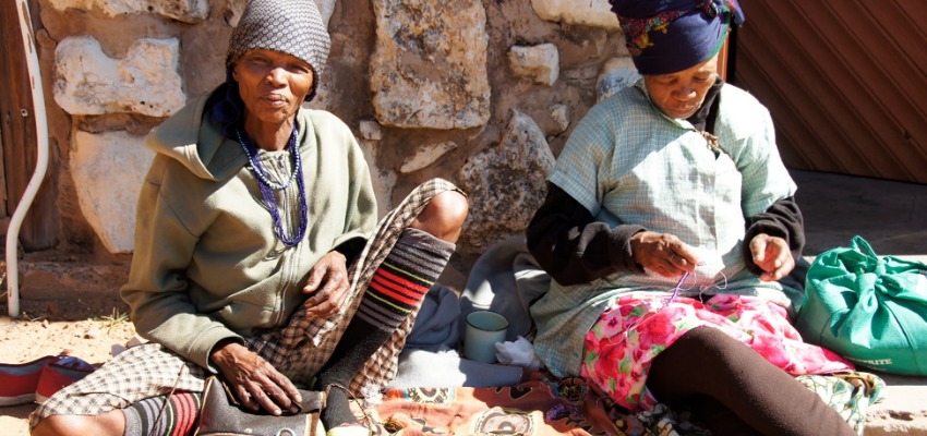 One of the traditional skill builder sessions, we learned from Tabaxae (left) how to make ostrich eggshell beads, and from Ncabe (right) how to make glass-bead jewelry.