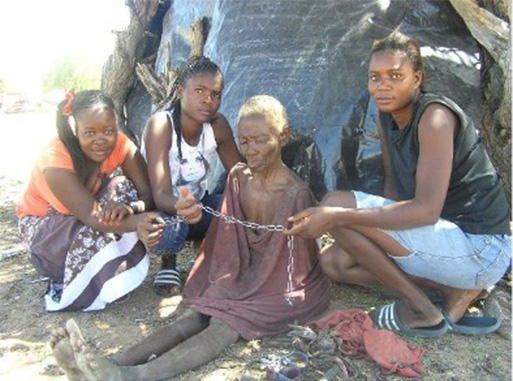 Group of women crouching on the ground.