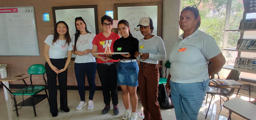 Students from MIT and UNAL and women miners with their birdcage.