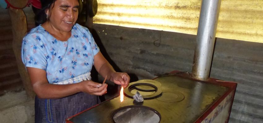 Woman lighting stove.