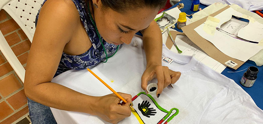 Woman painting t shirt