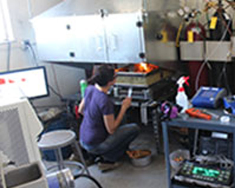 Dr. Vi Rapp of Berkeley tests a Berkeley-Darfur stove in the cookstove lab