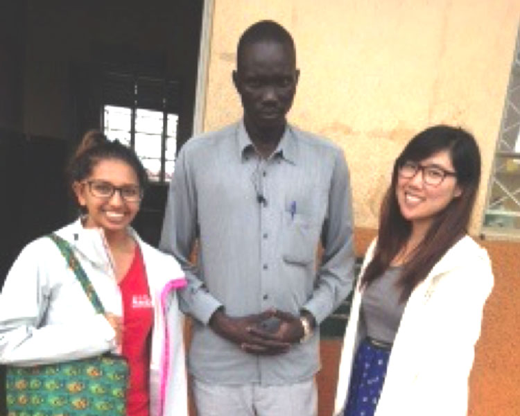 Nisha & Jeannie with Mr. Kut Buol, the head teacher of Ayilo Primary 1A.