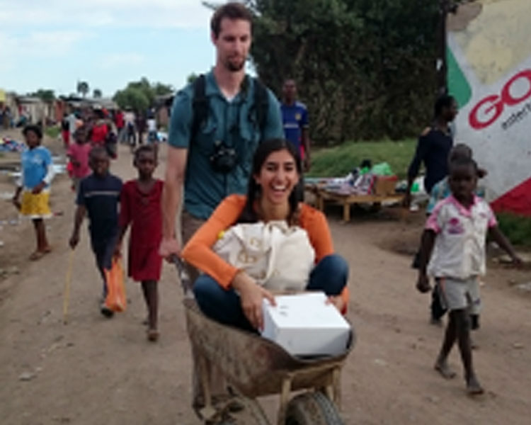 Chitti Desai getting a ride to a cookout from D-Lab instructor and trip co-leader Eric Reynolds.