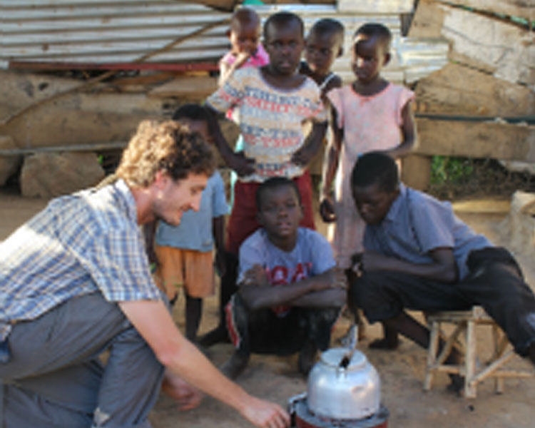 Dan installs a stove use monitor on a Makaa stove.