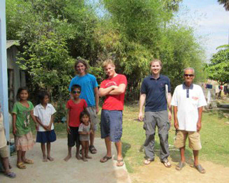 Team with village chief inquiring about sewage pumper