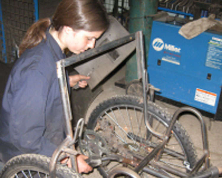 Welding the hand-cycle at APDK, Nairobi, Kenya.