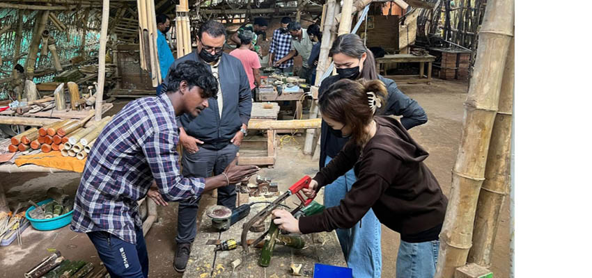 The process of sanding down the bamboo nails to smooth the fish-mouth joinery.